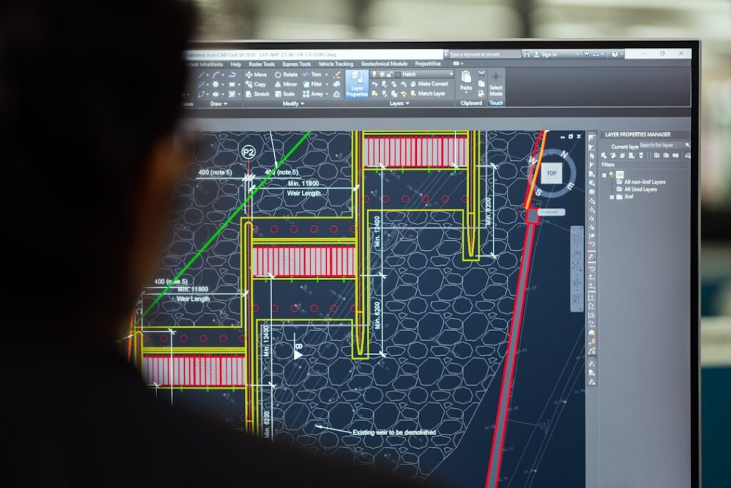 zipwp-image-hoivM01c-vg Female civil engineer designs weirs on computer